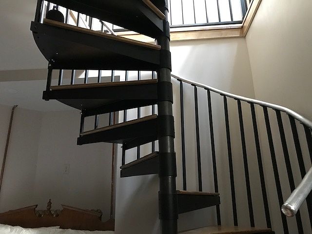 Looking up spiral staircase to main level