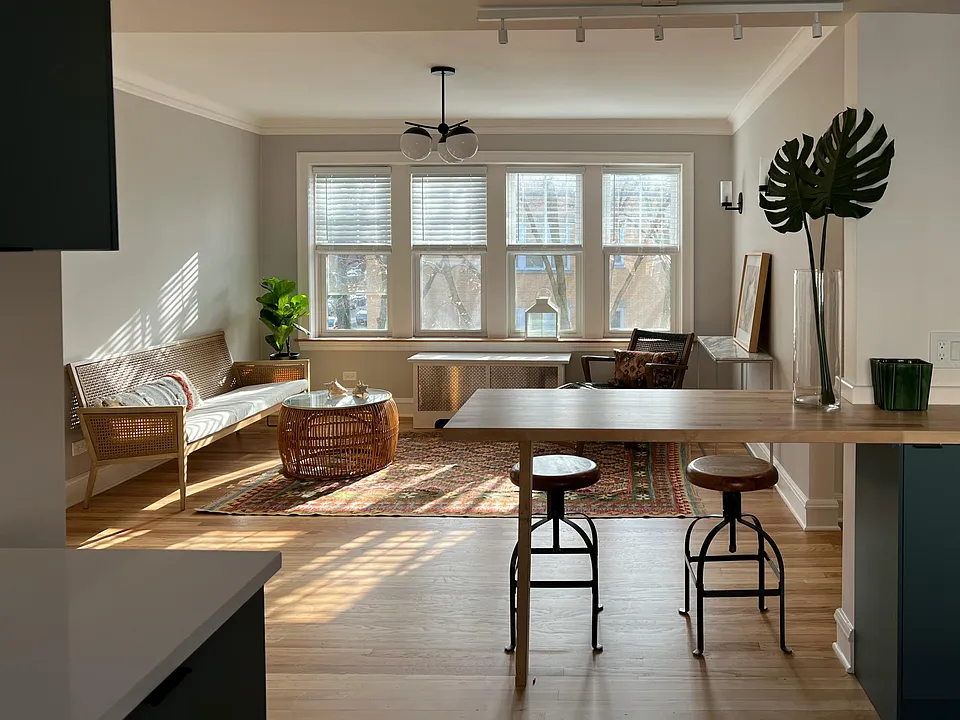 Kitchen with breakfast bar open to living room