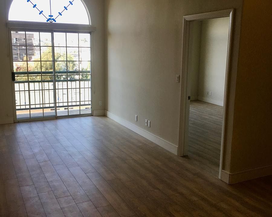 View of living room and balcony fror the front entrance