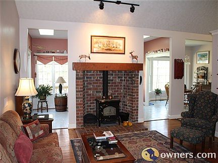 Great room 1open floorplan, custom fireplace, cathedral ceilings