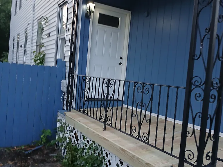 Renovated porch, new door and new porch light.