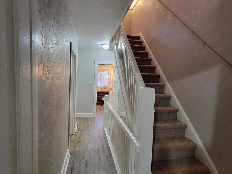 2nd floor layout with stairs leading up to 3rd floor which includes bedroom #4 and bathroom #2.