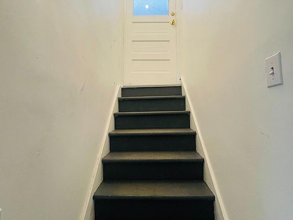Stairs from the garage up to the house