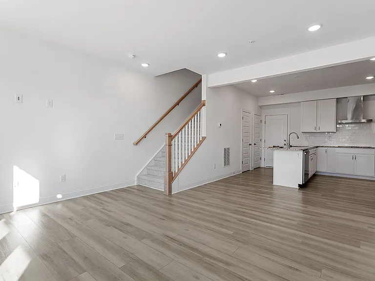 large, open kitchen-living room with space for dining table
