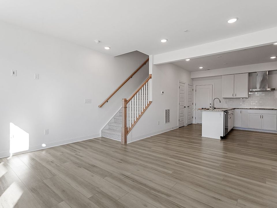 large, open kitchen-living room with space for dining table