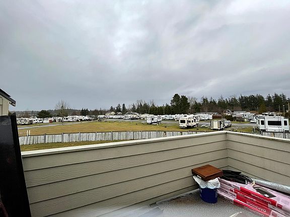 private patio with large lockable storage. RV park behind townhouses