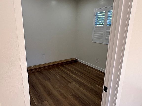 Window with A/C and wood shutters