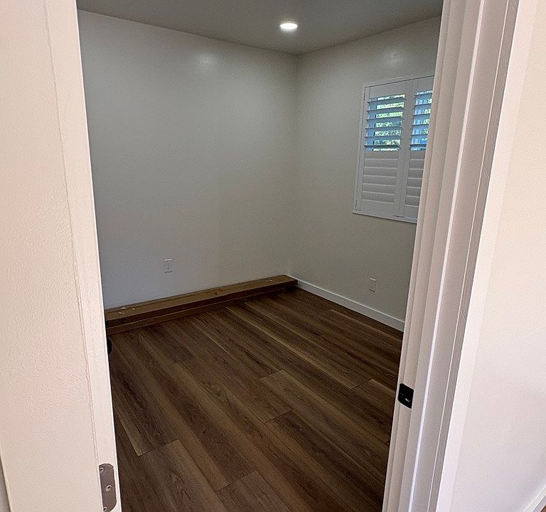 Window with A/C and wood shutters