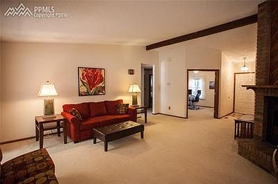 Entry into this spacious living room, with lovely exposed beam.
