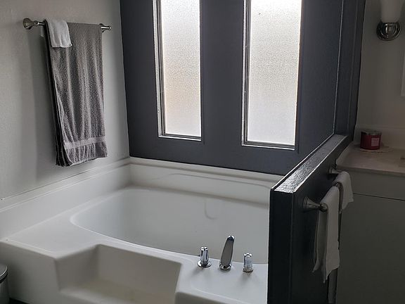 Master bath with shower and sunken tub