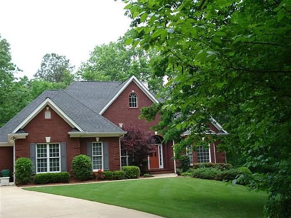 Brick Ranch Home on Full Finished Basement sits on 2.9 private acres.