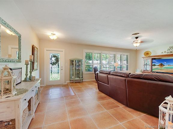 Light and bright living area with plantation shutters