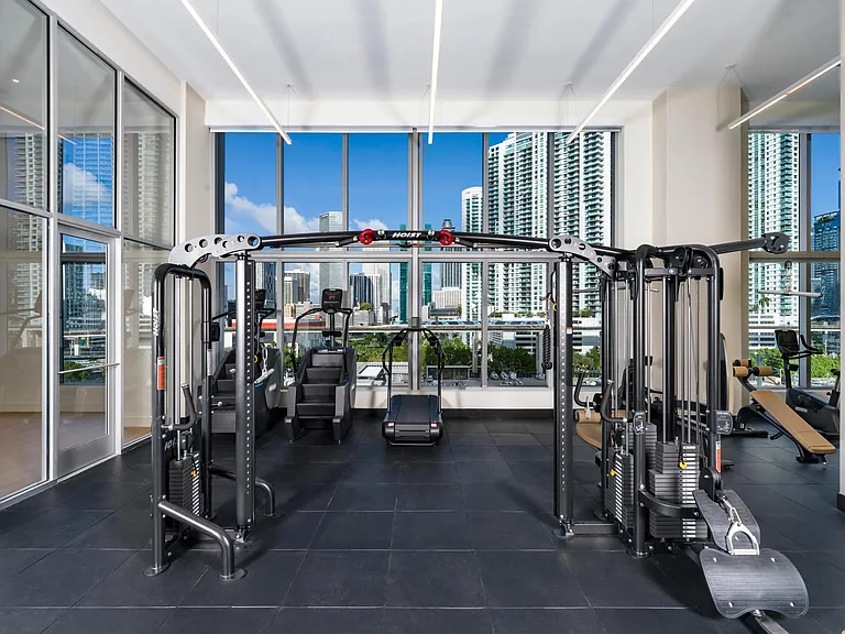 Strengthen your routine at Modera Riverside's fitness center, complete with inspiring views of the Miami skyline.