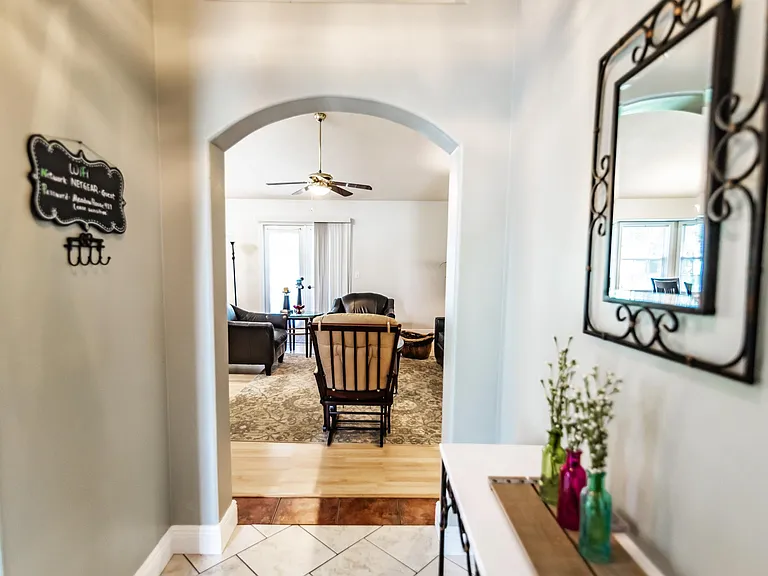 Entry way looking into large living room.