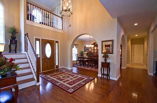 Gorgeous foyer with tall ceilings and hardwood floors!