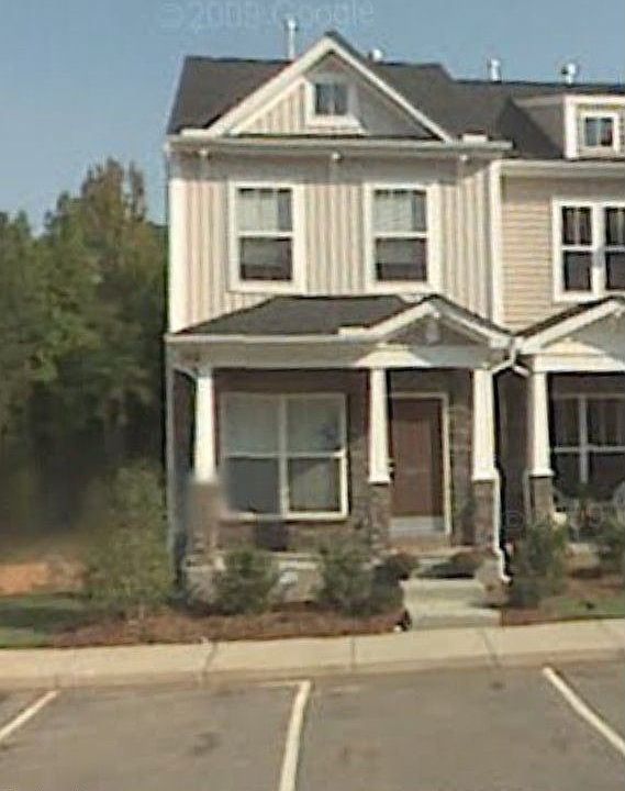 End unit in Townes at Umstead.  Backs up to protected wooded area.