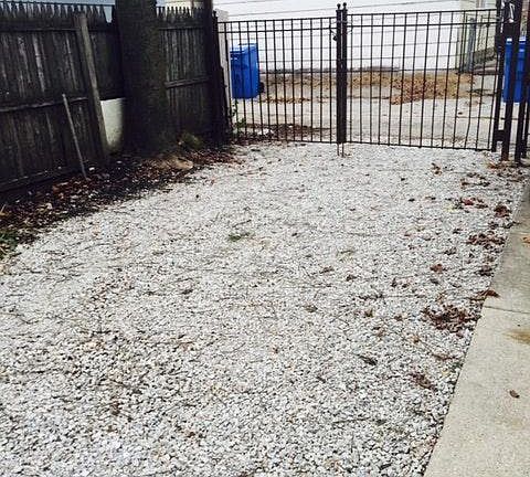 car port- recently paved with concrete