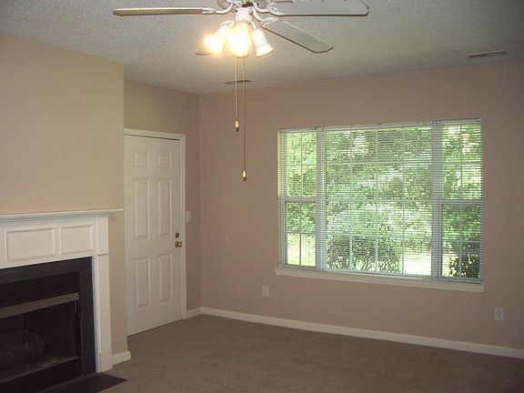 Great Room. End unit has additional windows. Opens to a private patio with outside storage.