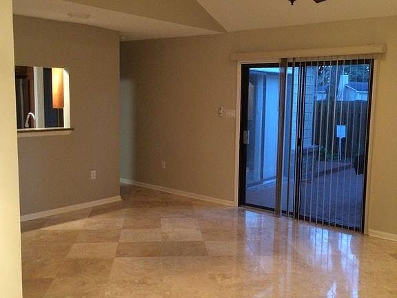 Large sliding doors open to private courtyard