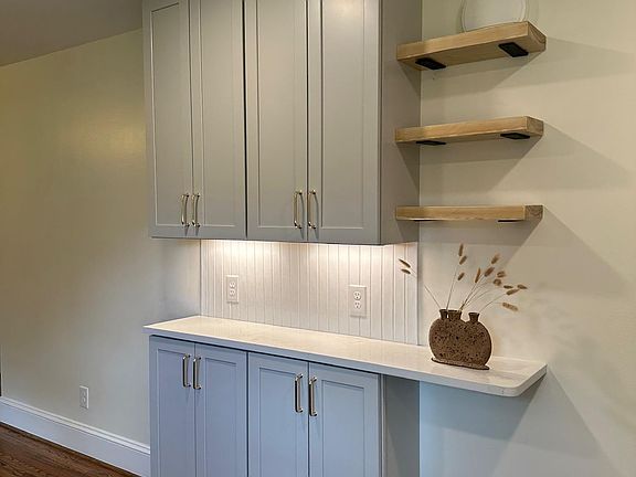 Additional kitchen storage and coffee bar.
