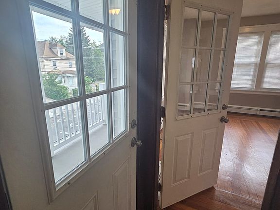 Entrance from front, to balcony and living rooms