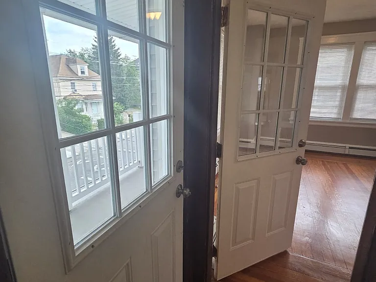 Entrance from front, to balcony and living rooms