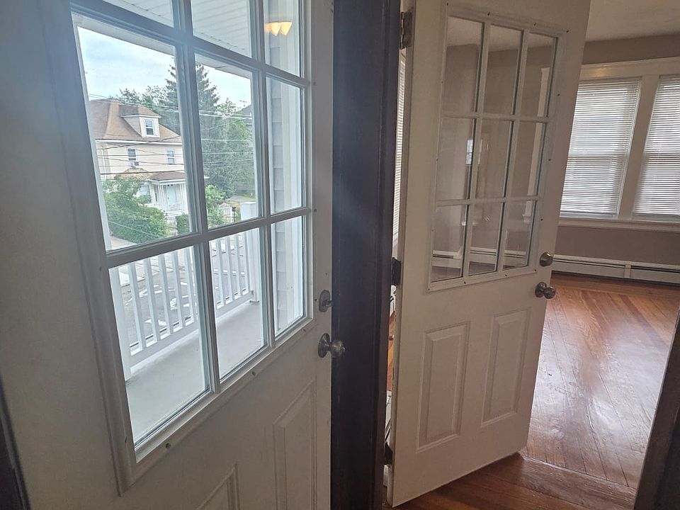 Entrance from front, to balcony and living rooms