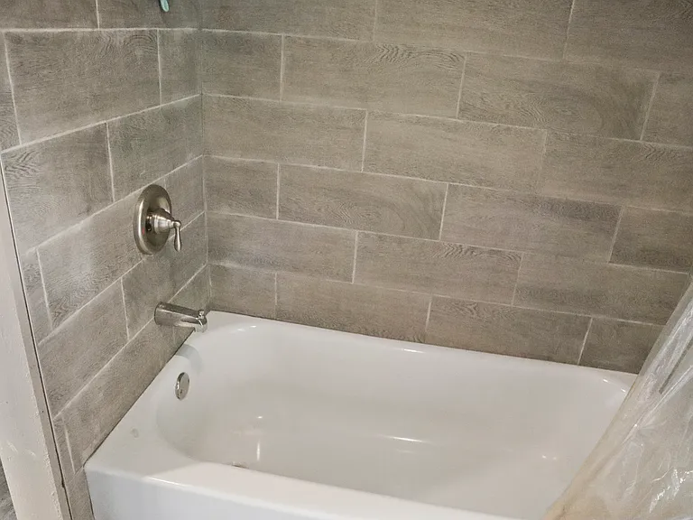 Full bathtub and shower.