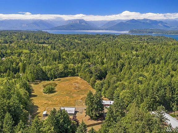 Breathtaking view from high above...the property is just minutes from the Hood Canal with the Olympic Mountains beyond.