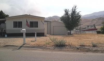 front of home w/ canal at right in back