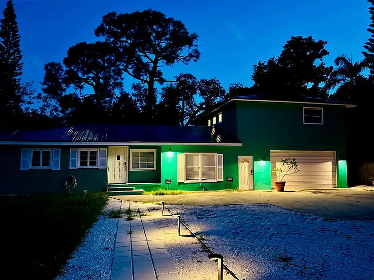 the Main Stay is an attached single story home with private entry stoop, and two private decks at the rear yard. Walkable to Downtown Bonita Springs!