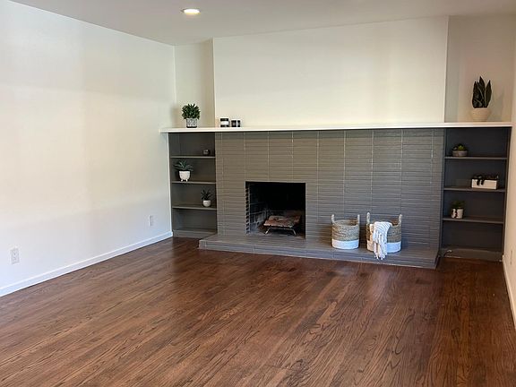 Hardwood floors throughout living, dining, bedroom.