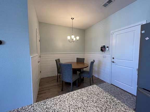 Open concept living room, kitchen, and dining room