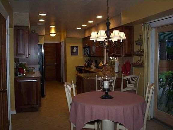 Eat-in-kitchen with upgraded cabinets, pull out and pantry.