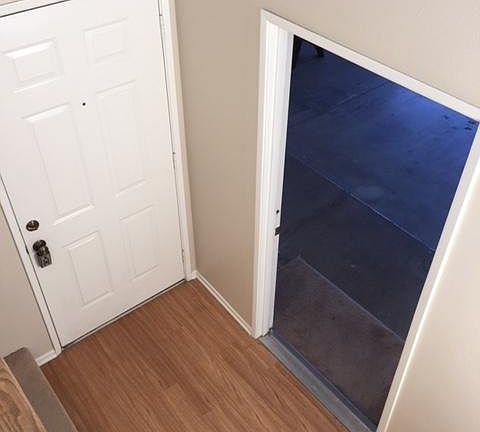 Stairway looking into attached Garage