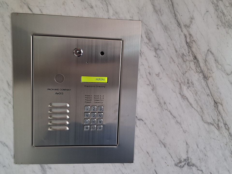 We value your safety! The Aurora is a locked building. The well-lighted lobby is monitored by a camera. Guests must call your cell phone via this device, and you can buzz them in - even if you're not in the building.