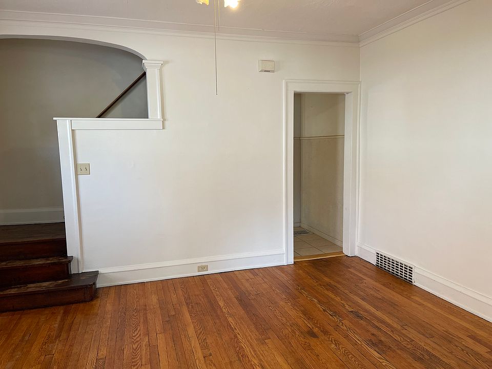 Dining room with stairs to 2nd floor and entry to kitchen