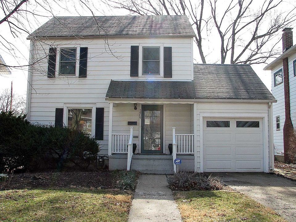 2-story home with one car attached garage.