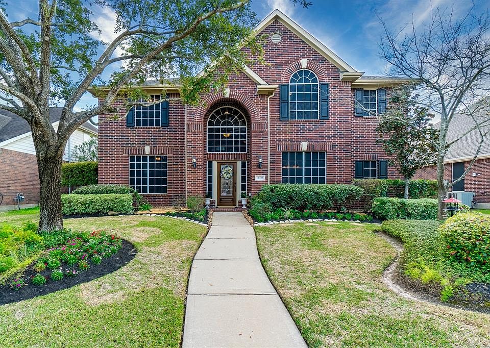 Lovely two story home with a pool located in desirable Village Creek.