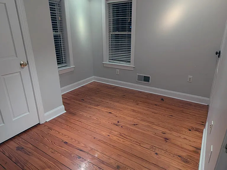 A second bedroom or office on the second floor has a closet, dimmable track lighting and a ceiling fan.