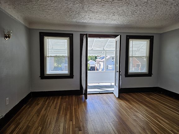 Living room opens onto covered porch