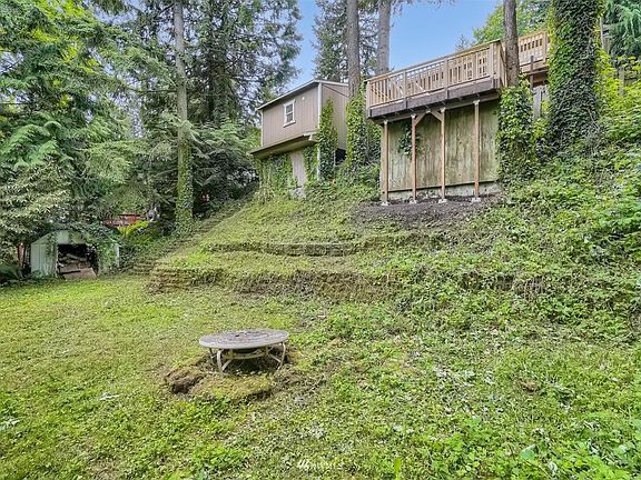 back yard with wood fire pit