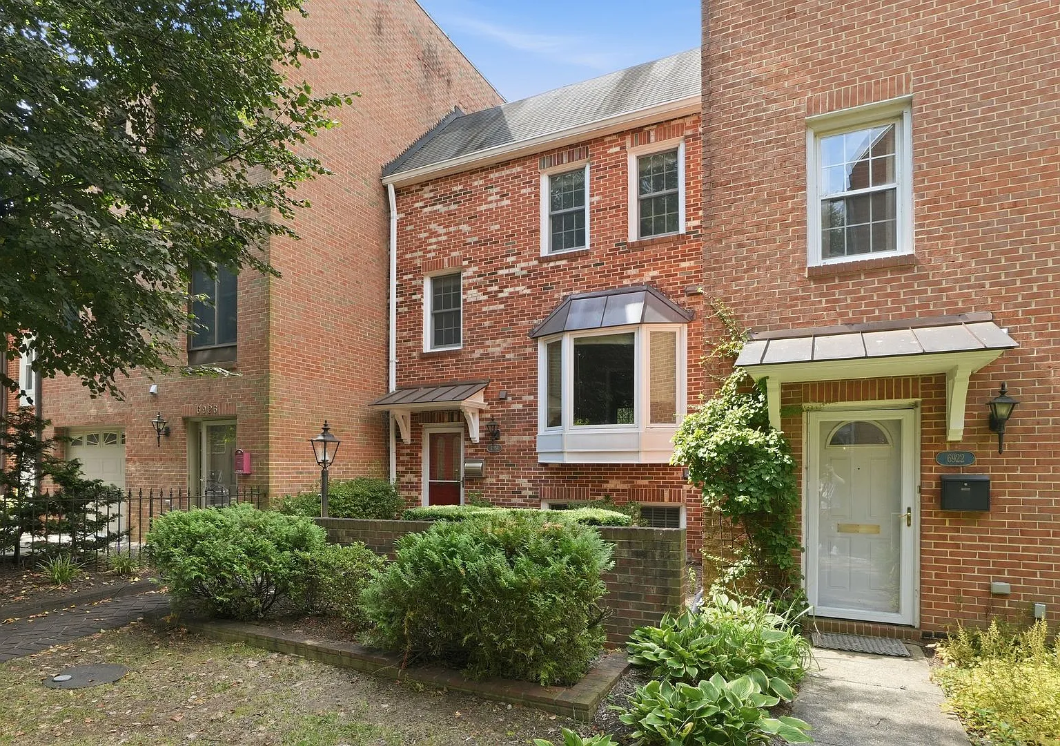 Charming four-bedroom brick townhome ideally located in the heart of McLean! T — Photo 2