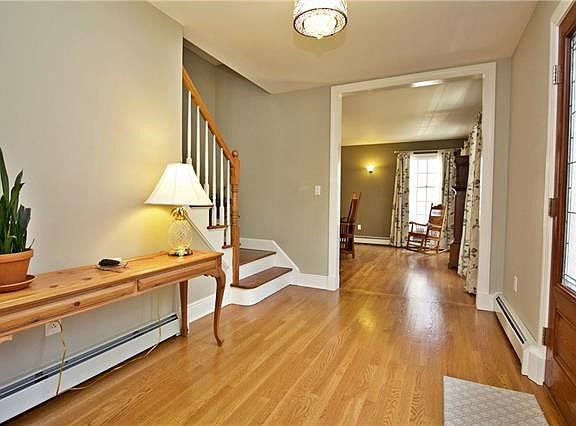 Welcome to this stunning colonial home.  Gleaming hardwood flooring throughout.  Custom lighting accents this incredible home.