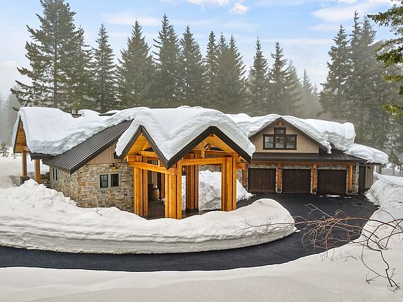 Nestled into private acre lot