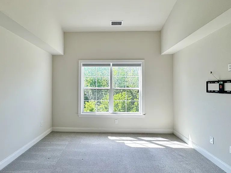 Primary bedroom suite with walk-in closet.