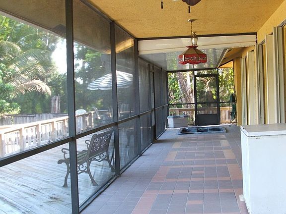 Screened patio with built in jacuzzi and half bath