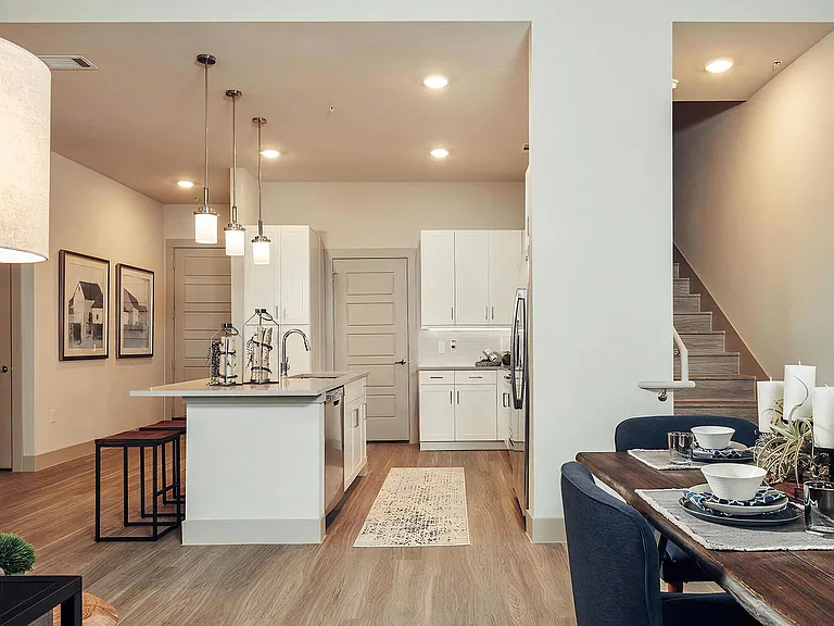 Open Kitchen and Dining Area with Upstairs Loft Access