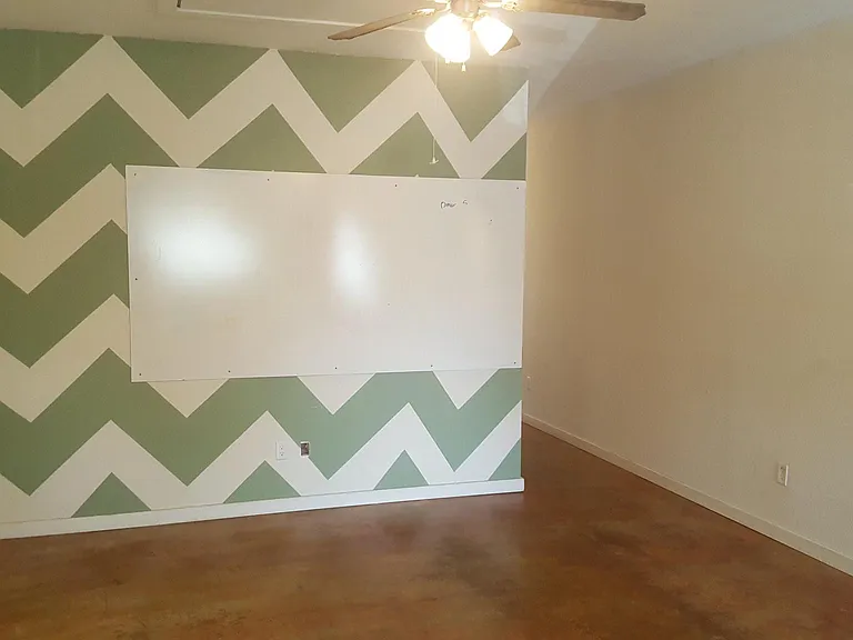 Walls being painted to remove pattern wall.