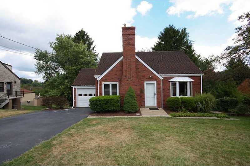 Exterior Front. Spacious brick home with a large finished basement. Plenty of off-street parking!